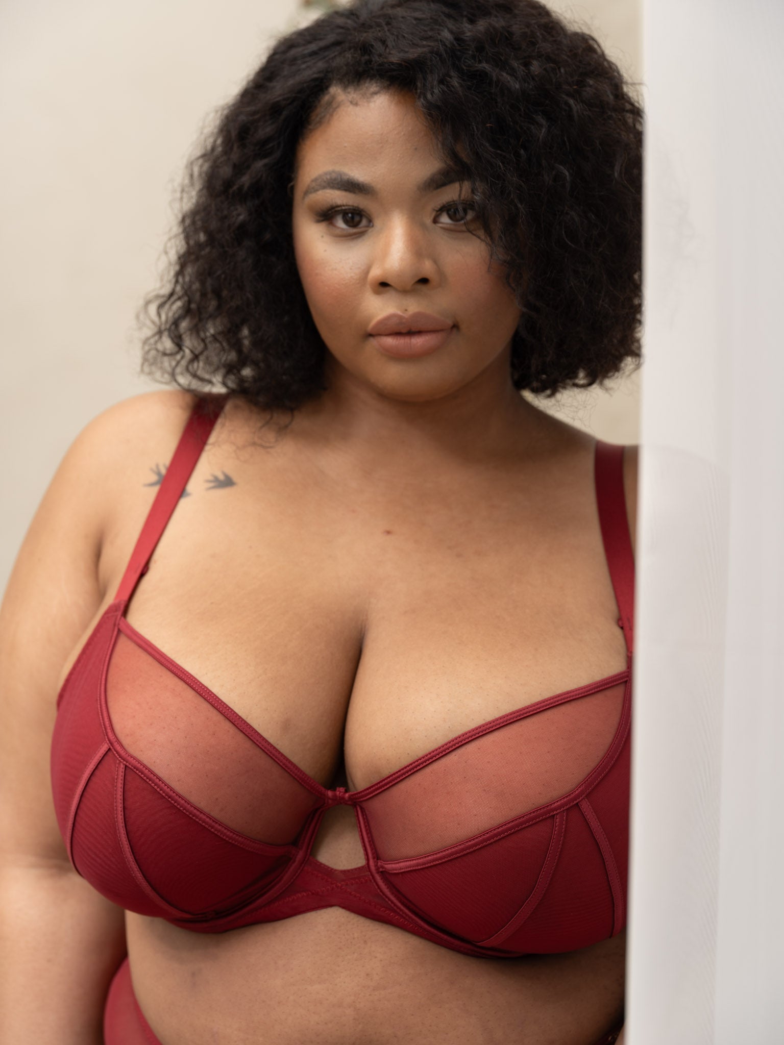 Detail of breathable red mesh cups on PKI-U WHISPER unpadded support bra