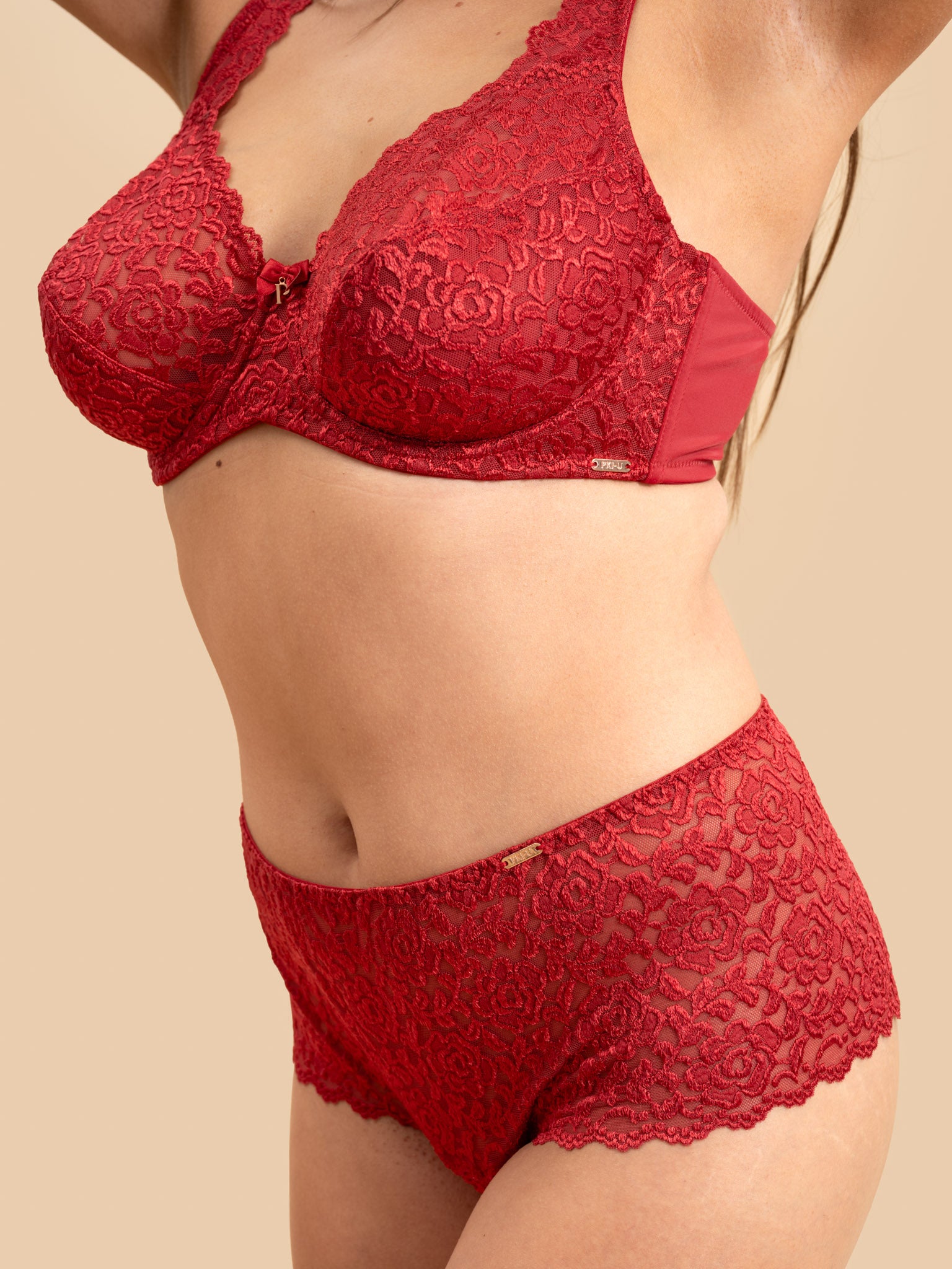 Red lace lingerie set on a beige background