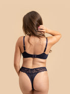 Rear view of the Navy Blue velvet mesh thong and bralette straps.