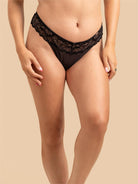 Alternative front angle of the Black SHADOW Velvet Thong on a model.