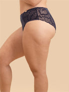 Close-up side profile of the breathable mesh and lace brief in Navy Blue.